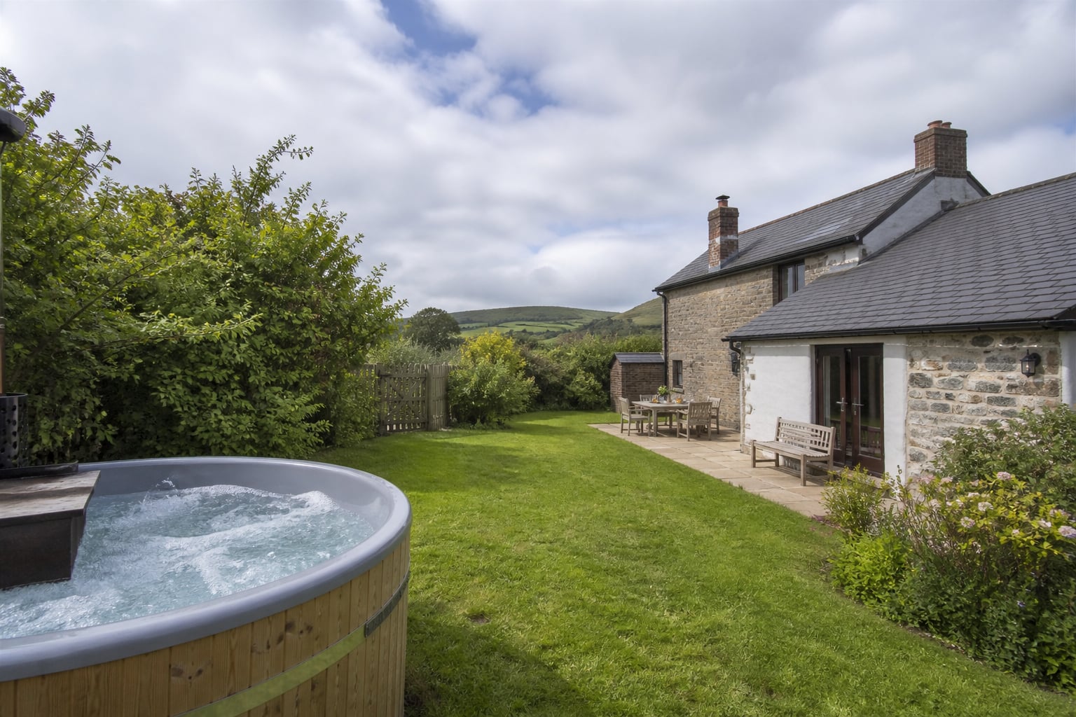 Wide deck context for the Totnes hot tub